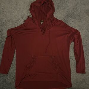 Burgundy hooded pullover with pocket. 92% polyester 8% spandex